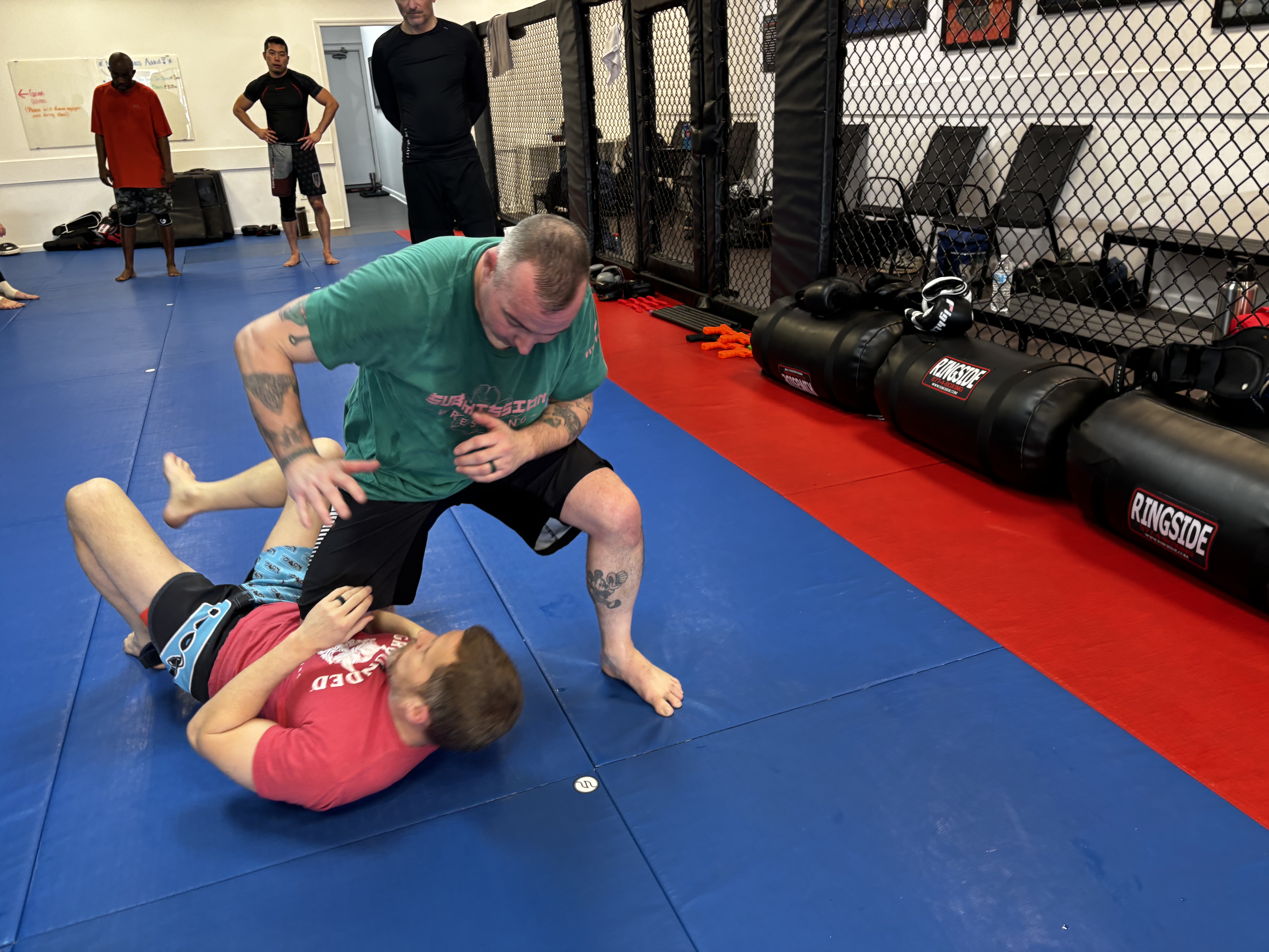 Grounded knee on belly defense escape demo